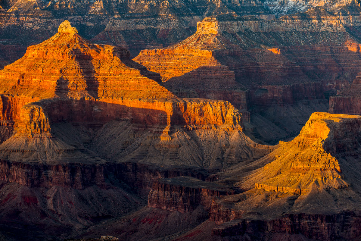 Warm light adds contrast and detail to formations in the South Rim, Grand Canyon National Park, Arizona.