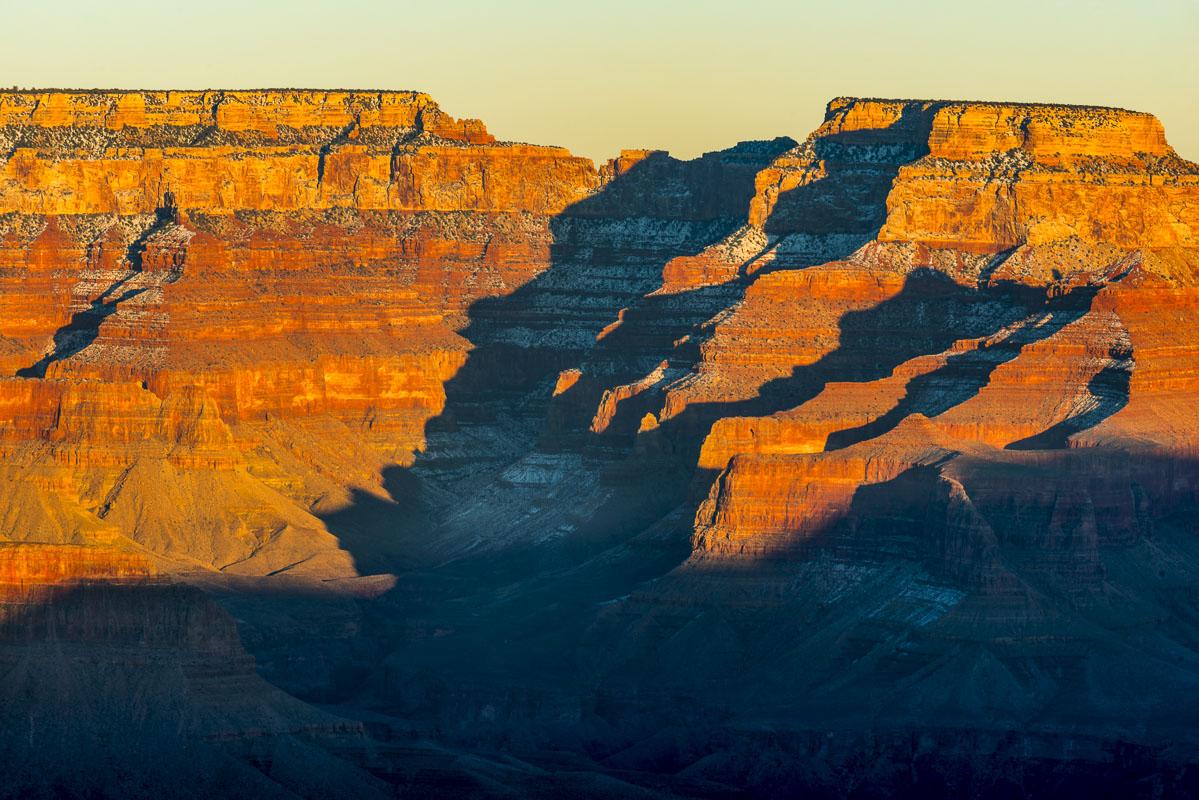 Low afternoon light plays a game of light and shadow across formations in the South Rim, Grand Canyon National Park, Arizona.
