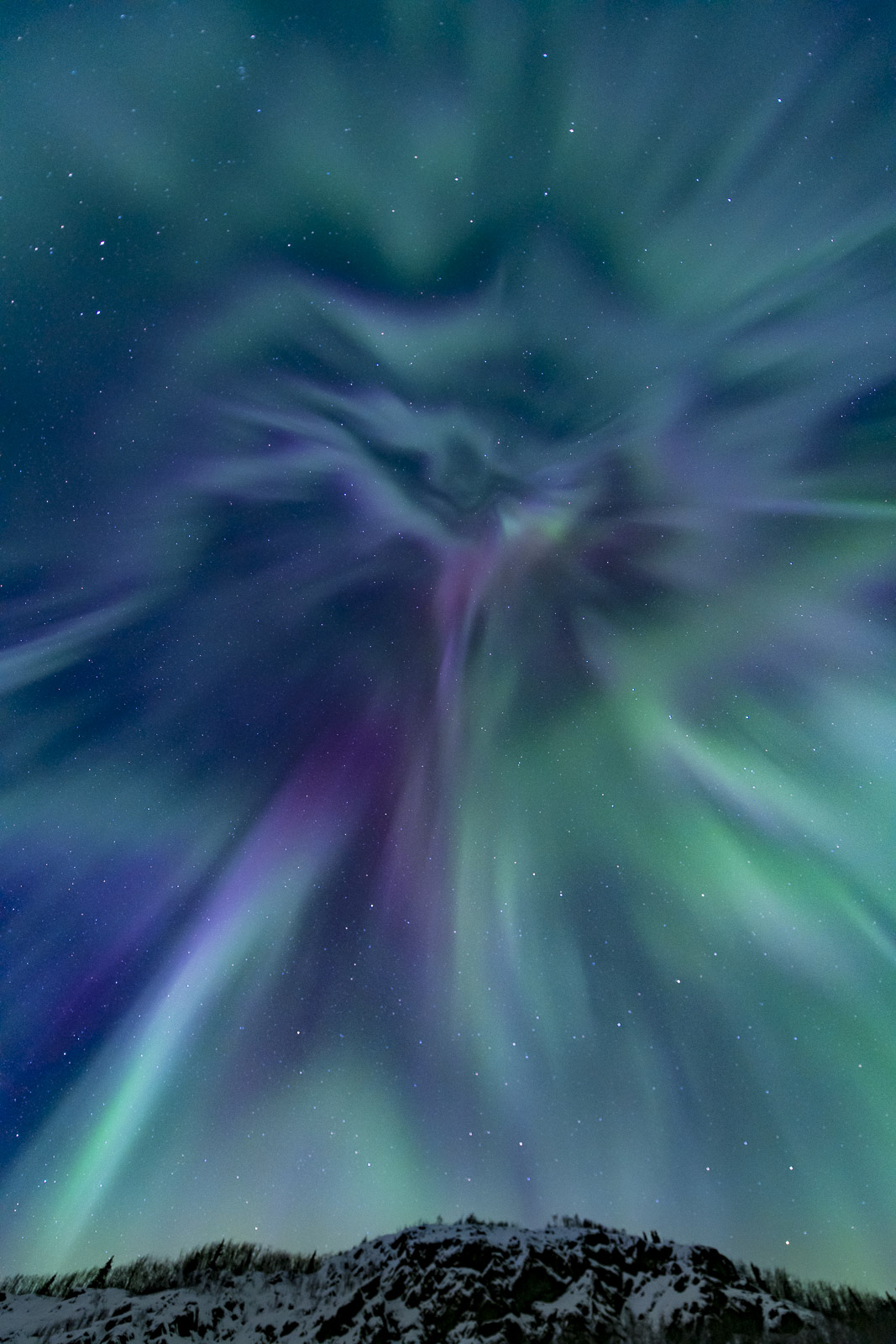 While stopping to photograph the aurora borealis over the upper Matanauska River, I looked above and behind me to see this towering...