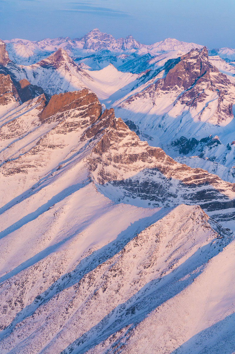 Morning light strikes the front of the Arrigetch Peaks and Mt. Igikpak, the highest peak in Gates of the Arctic National Park...