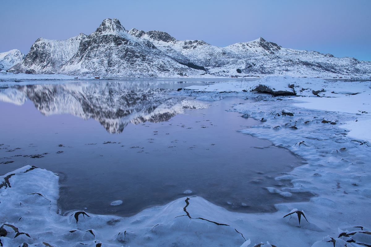 The Lofoten Islands in Norway offer unending views of islands, channels and fjords. Here, subtle winter pastels of blues and...