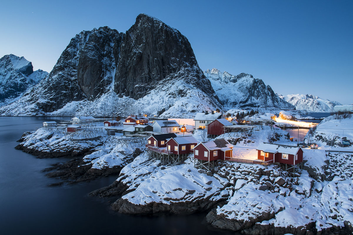 At twilight, or "the blue hour," is a great time to photograph the red cabins at Hamnøy, in the Lofoten Islands, Norway.