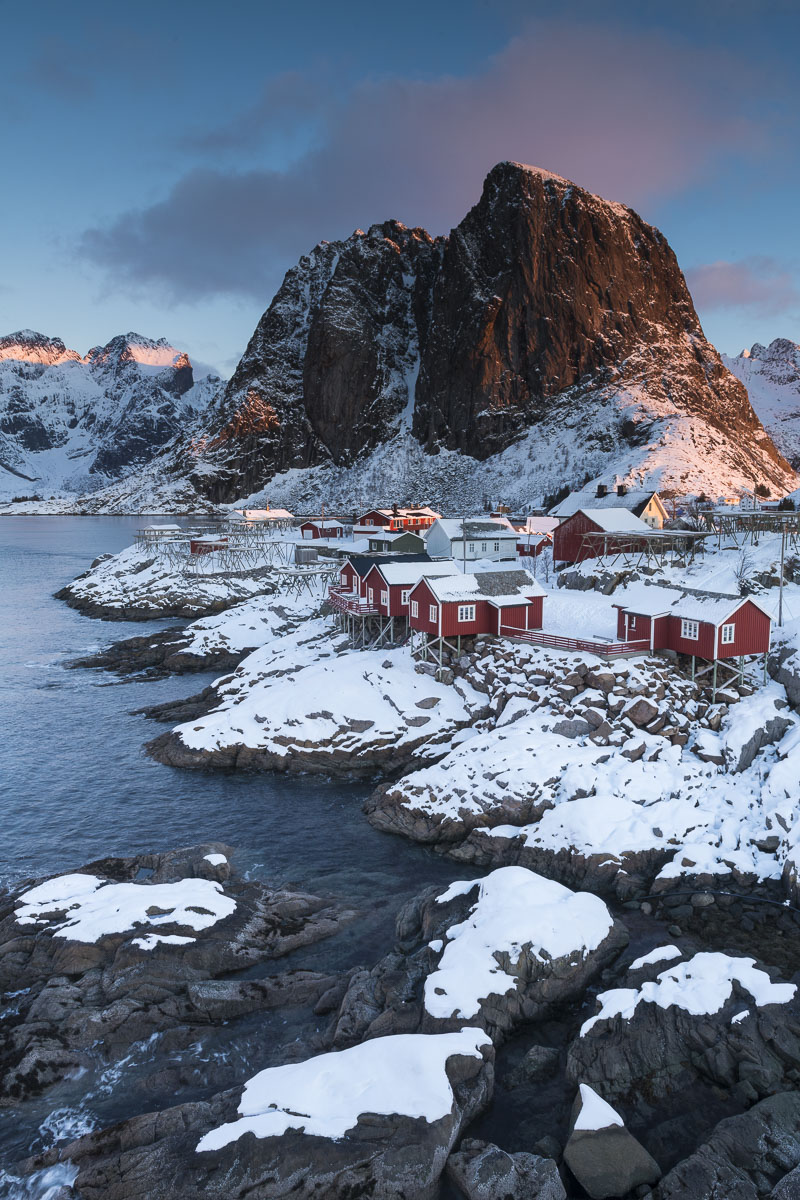 Red fishing cabins, or rorbuer, are a common sight in the Lofoten Islands, and integral to this iconic photo location.