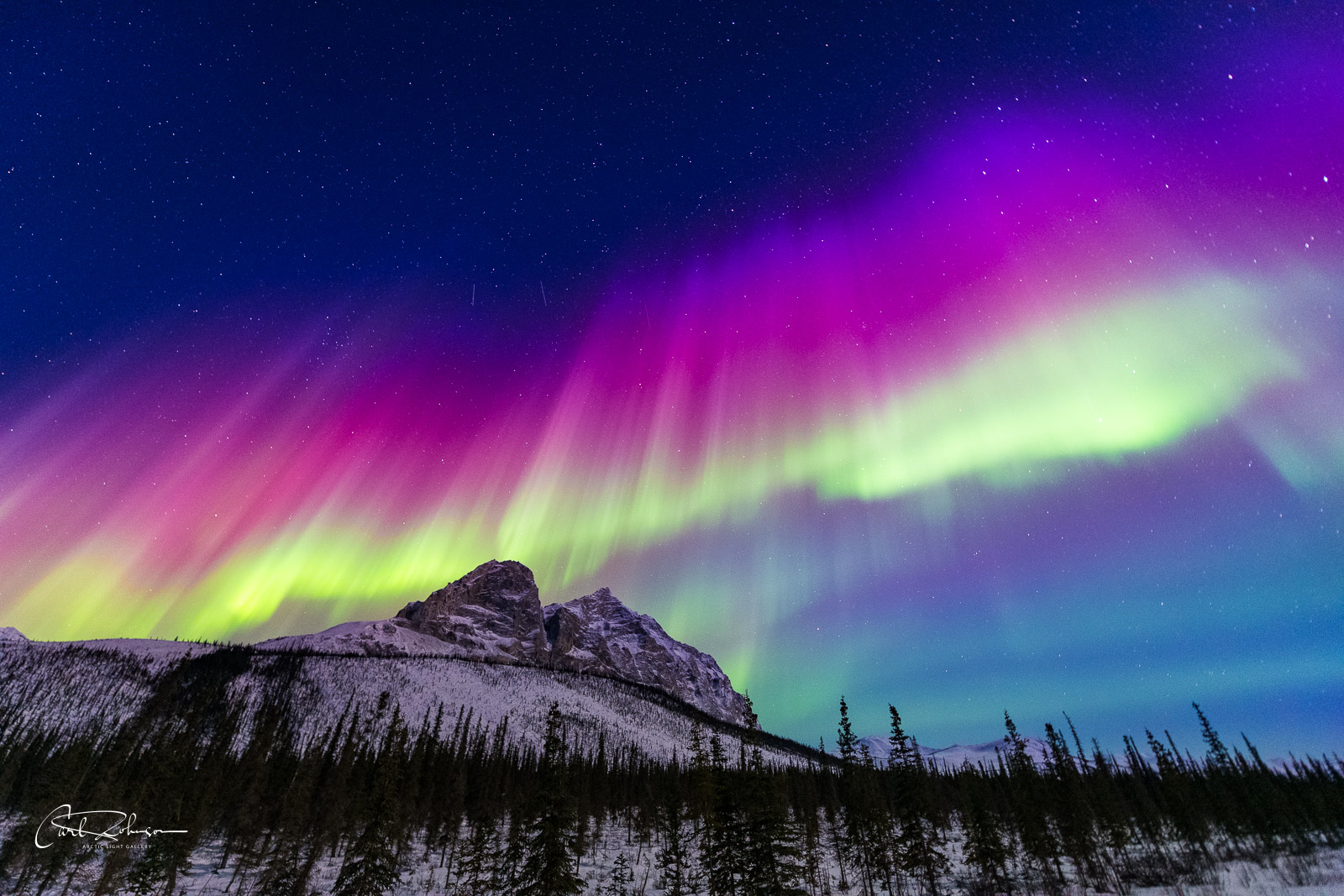 The first displays of a Kp6 aurora on the eve of the spring equinox bring fiery colors over Mt. Sukakpak, Brooks Range, Alaska...