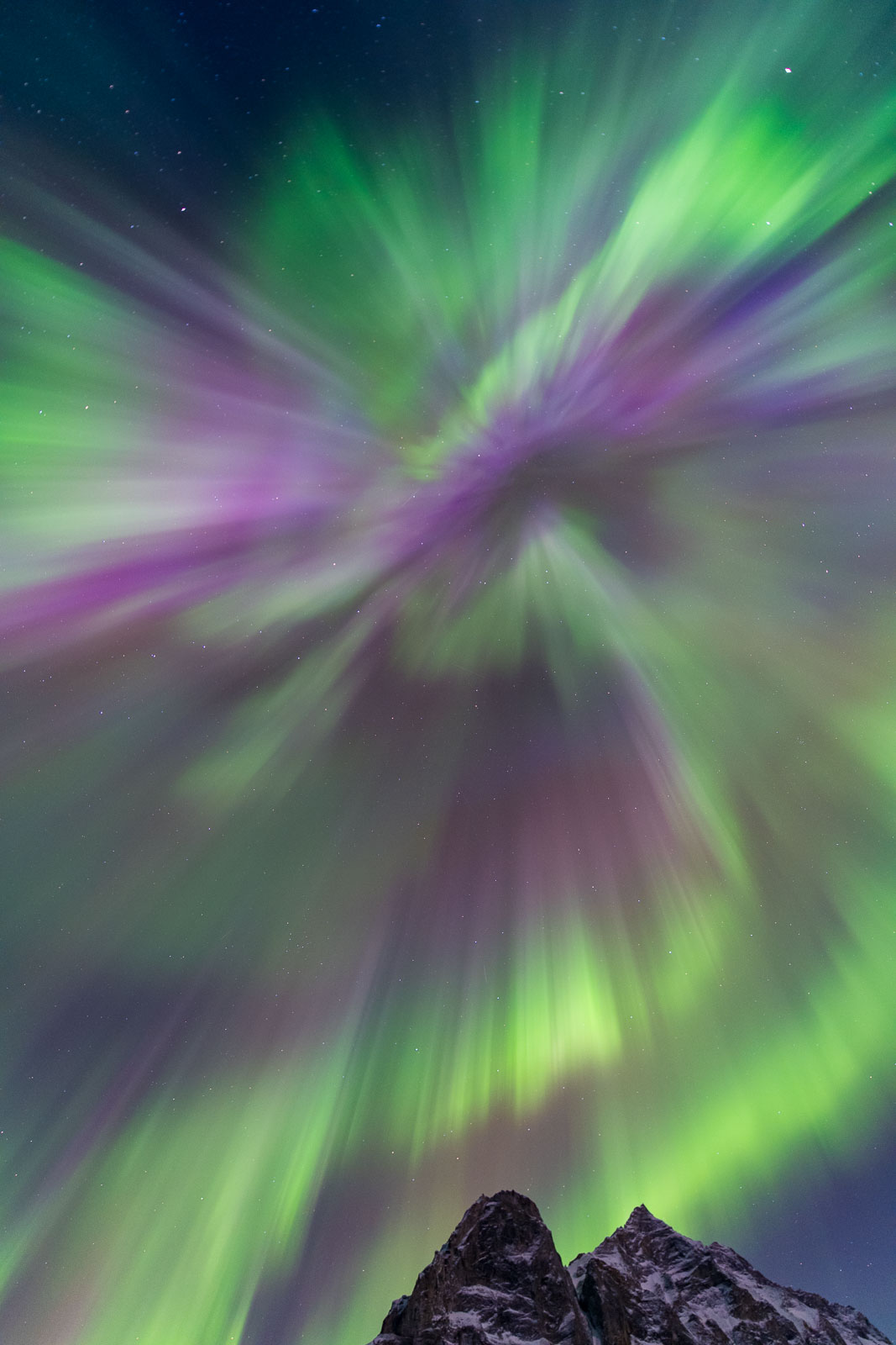 A corona display from a Kp6 aurora soars over Mt. Sukakpak, Brooks Range, Alaska.