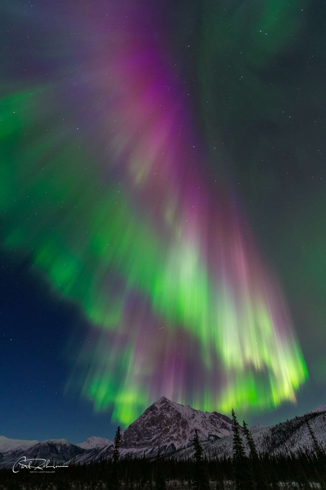 A Kp6 aurora borealis rains color over Mt. Dillon in the Brooks Range, Alaska