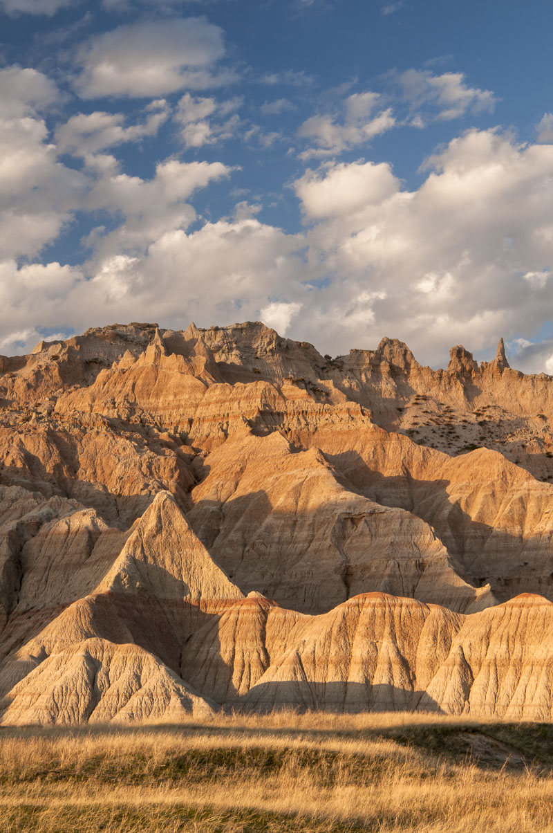 Evening light on formations near the Castle Trail in the Cedar Pass area , Badlands National Park, South Dakota.