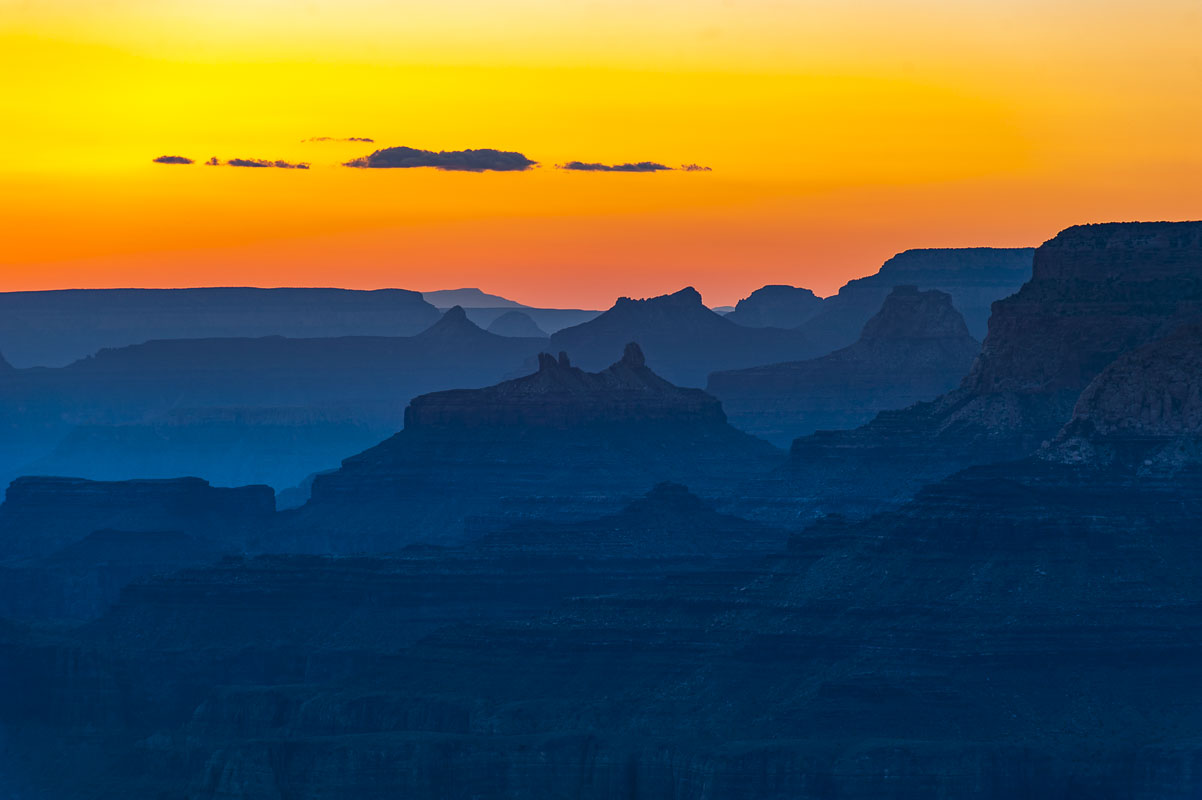 The last colors of sunset make the sky glow over the South Rim of the Grand Canyon. Haze in the air is pollution from Las Vegas...