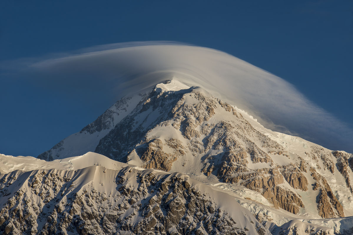 A lenticular cloud clings to the south summit of Mt. Denalil, Denali National Park & Preserve.