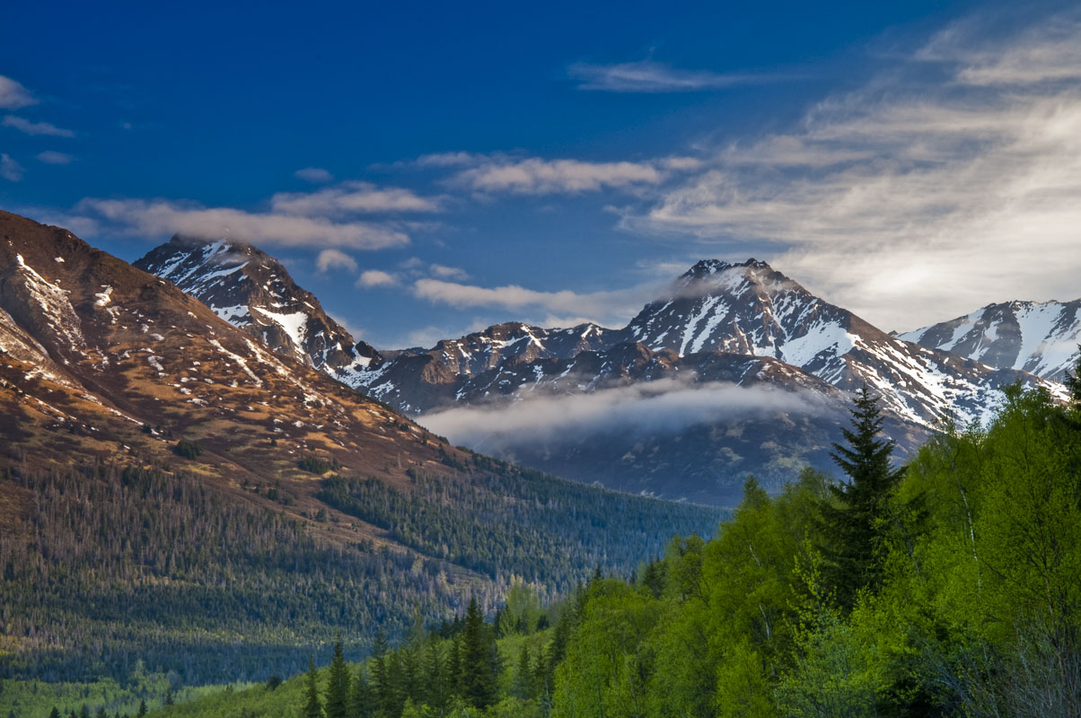 South and North Suicide peaks in Chugach State Park as veiwed from the Seward Highway along the Turnagain Arm in early summer...