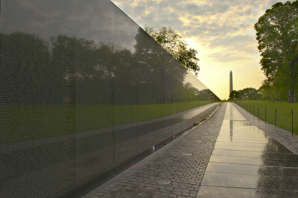 The wall at the Vietnam Veterans Memorial leads toward the Washinton Monument in Washington, D.C. Arriving at around sunrise...