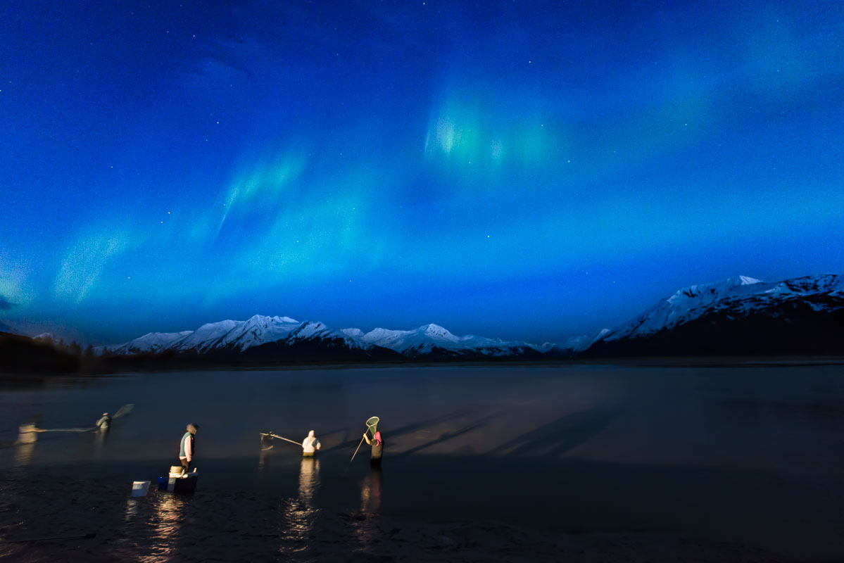 A group of hooligan dipnetters at the mouth of the Twenty Mile River, Chugach National Forest, enjoy working hard under a treat...