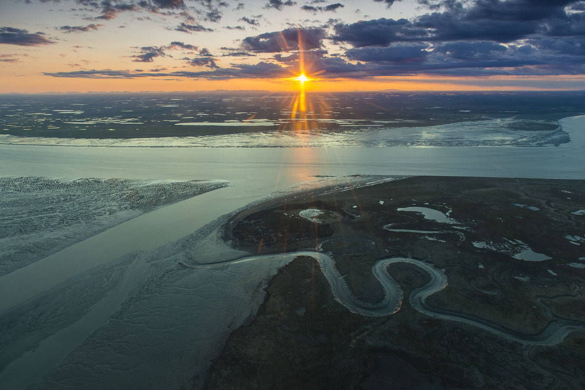 Sunset over the mouth of the Kvichak River, Bristol Bay. The Kvichak River hosts the largest return of Sockeye Salmon of any...