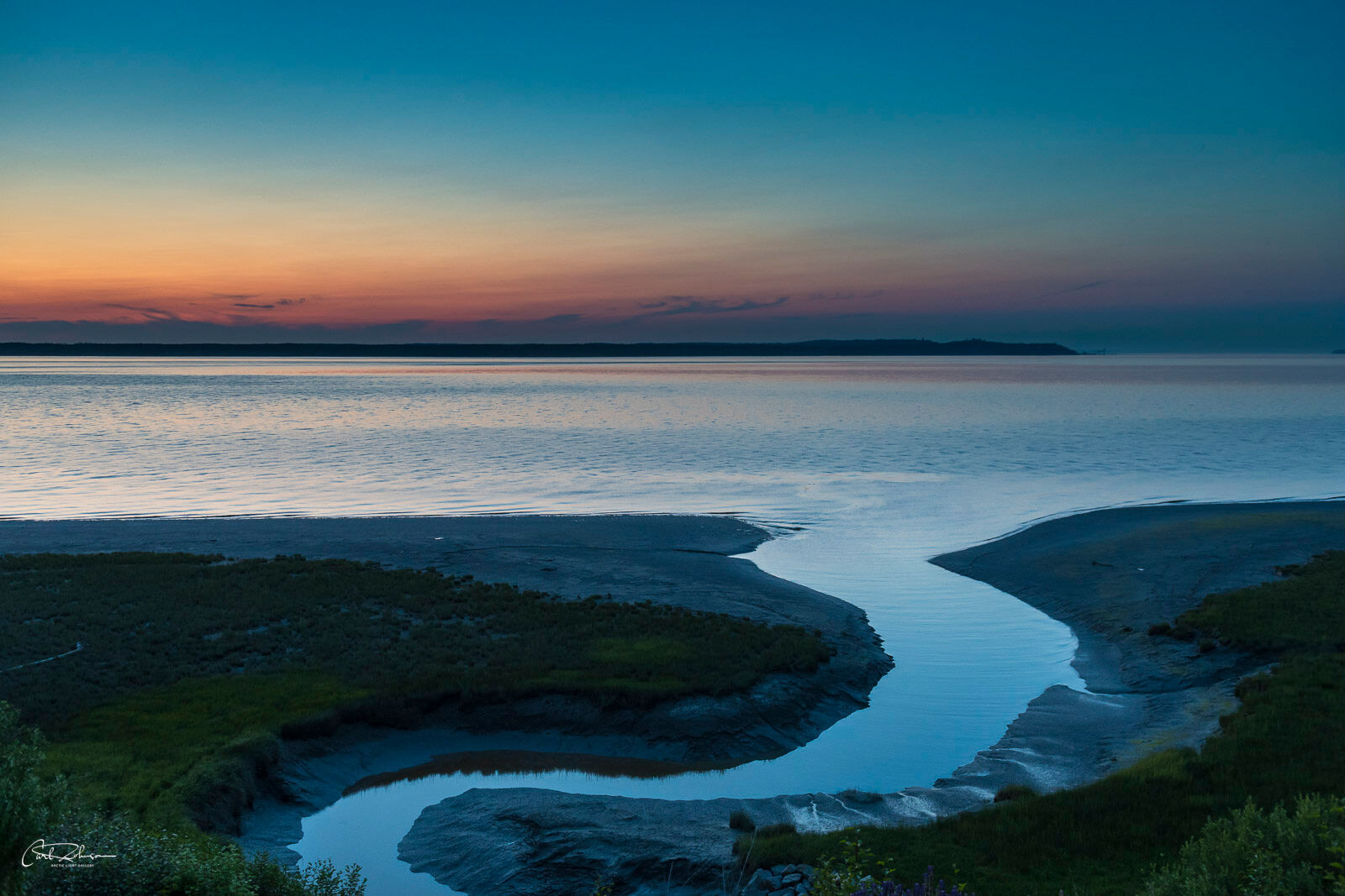 Slough Blue A small slough carves its way through the mudflats of Cook Inlet in Anchorage at around 1:00 a.m. on a long summer day.