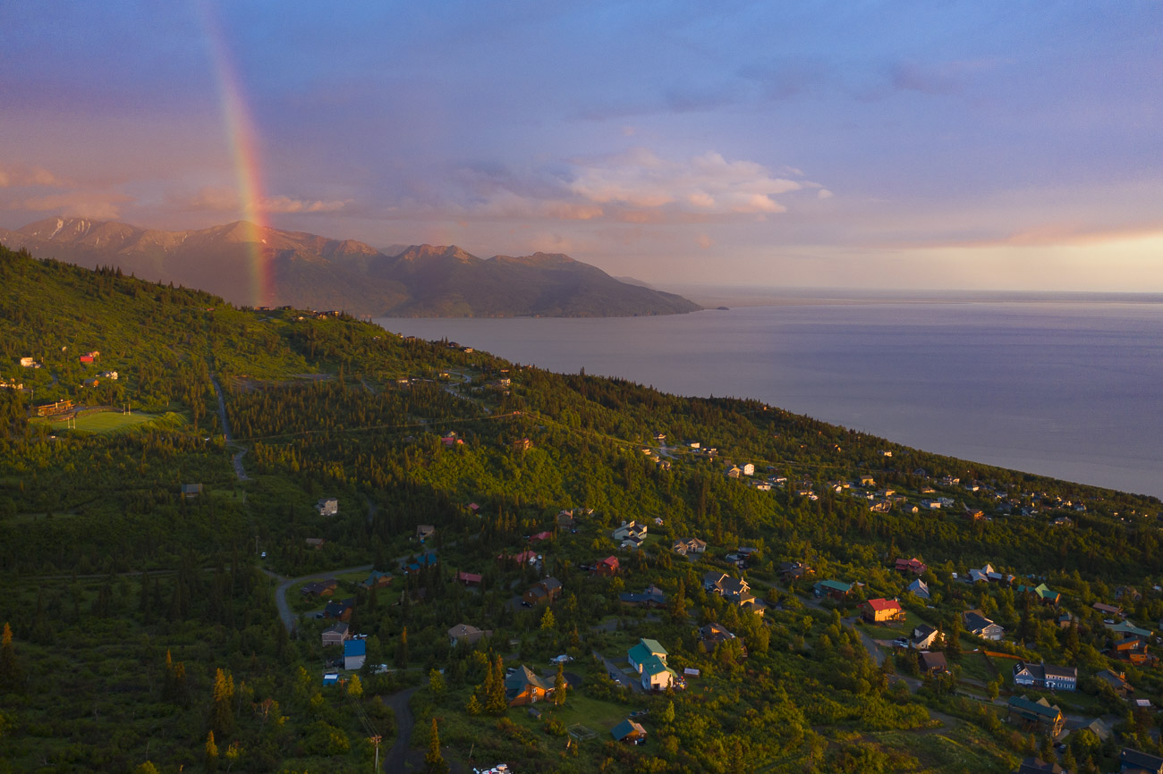 A summer rainbow lights up the sky over part of the Hillside area of Anchorage.