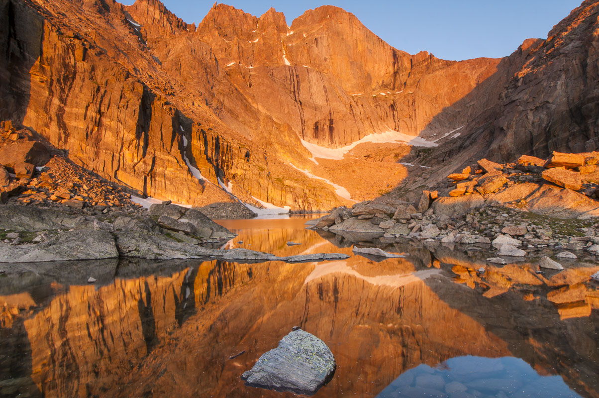 Morning light shines on the south face of Long's Peak, reflecting in Chasm Lake, Rocky Mountain National Park, Colorado. To capture...