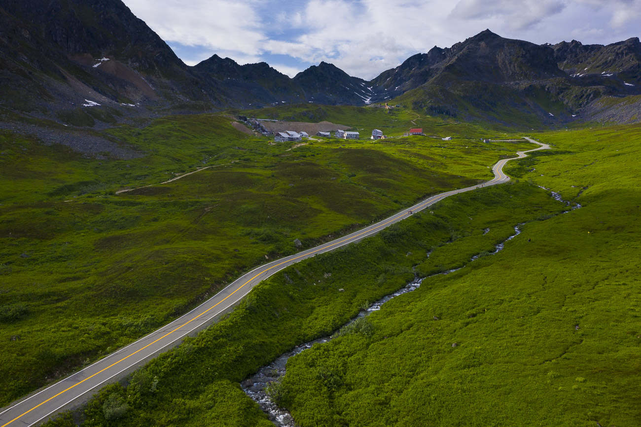 A paved road leads visitors up to the Independence Mine State Historical Site.