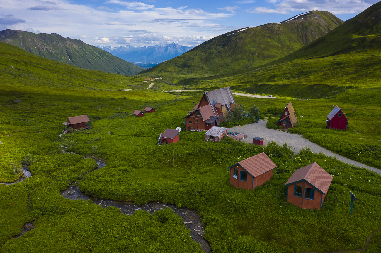 The Hatcher Pass Lodge consists of a series of cabins and a main lodge building, just downhill from the Independence Mine Historical...