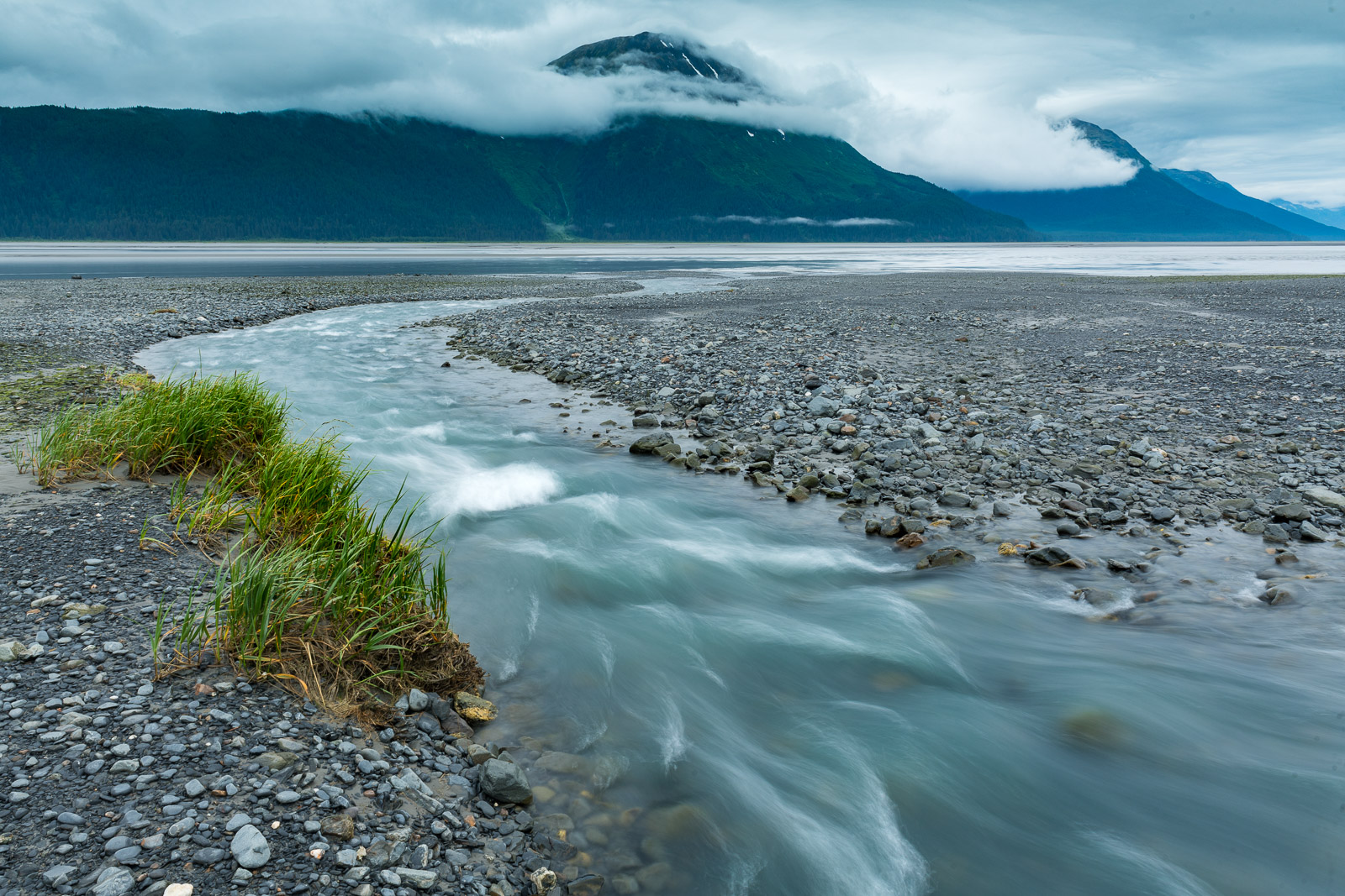 The outflow of Peterson Creek on the Turnagain Arm spills out through a gravel bar.