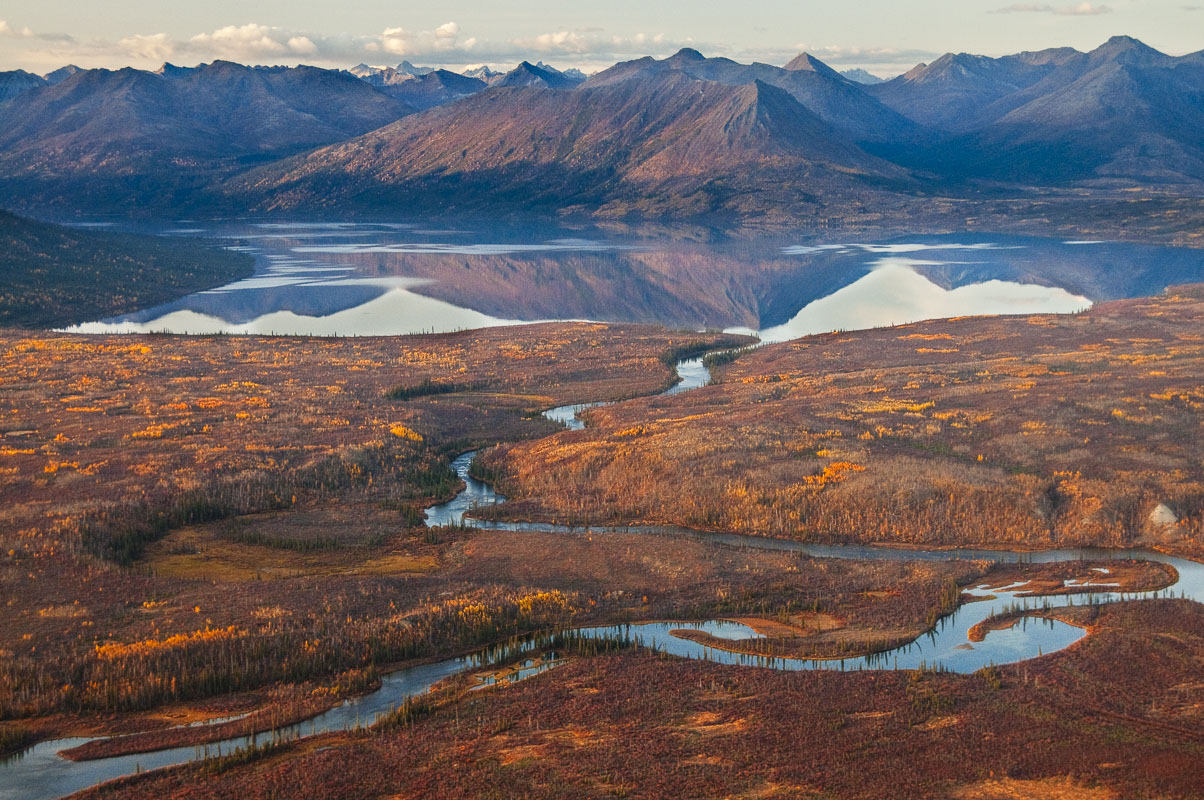 The lower end of Walker Lake, a National Natural Landmark, refelects evening light in the autumn in Gates of the Arctic National...