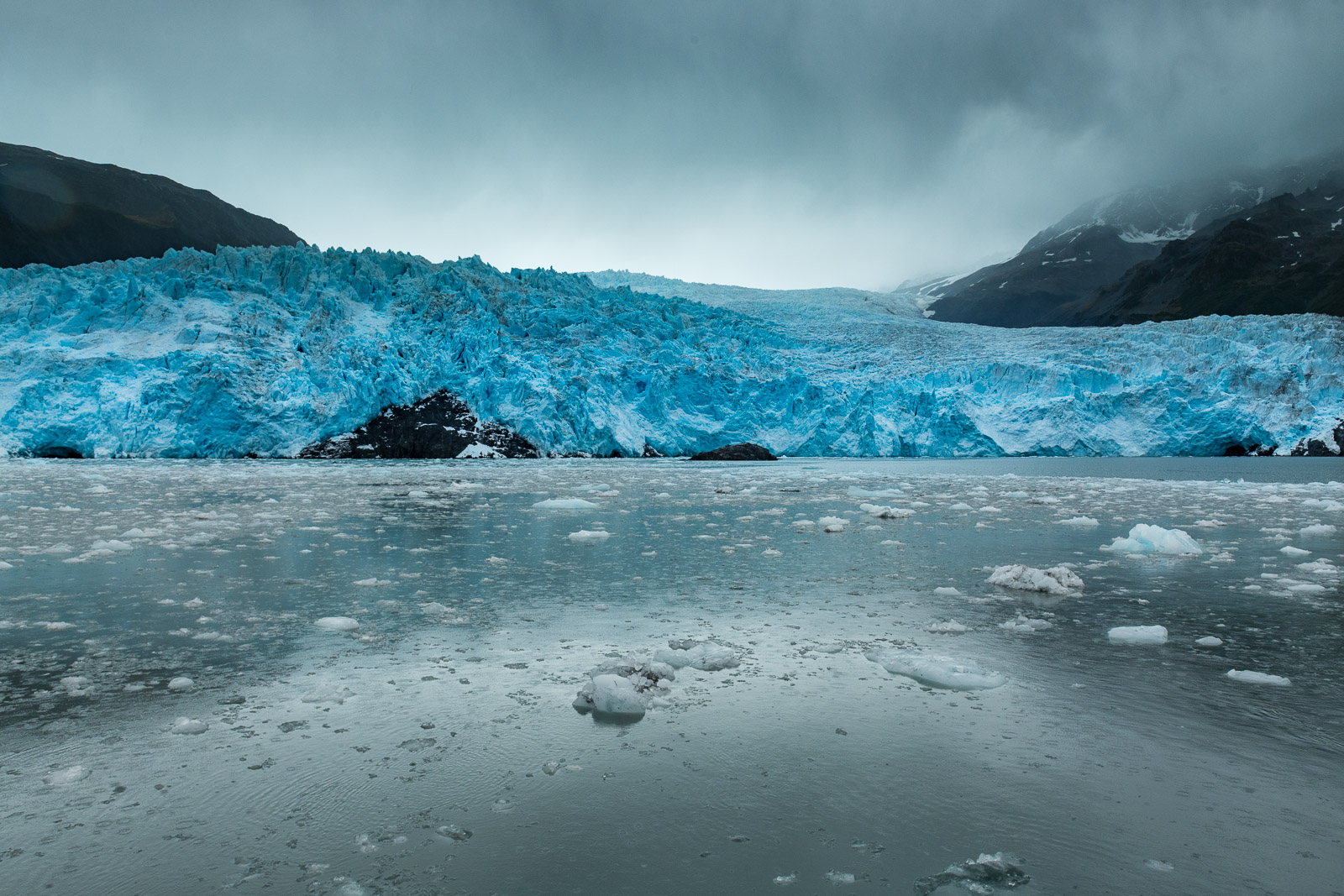 A glacier shows deep hues of blue in Kenai Fjords National Park, Alaska.