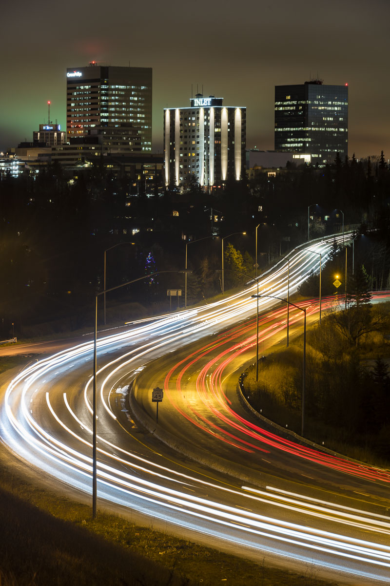 Traffic in and out of downtown Anchorage on a winter night.