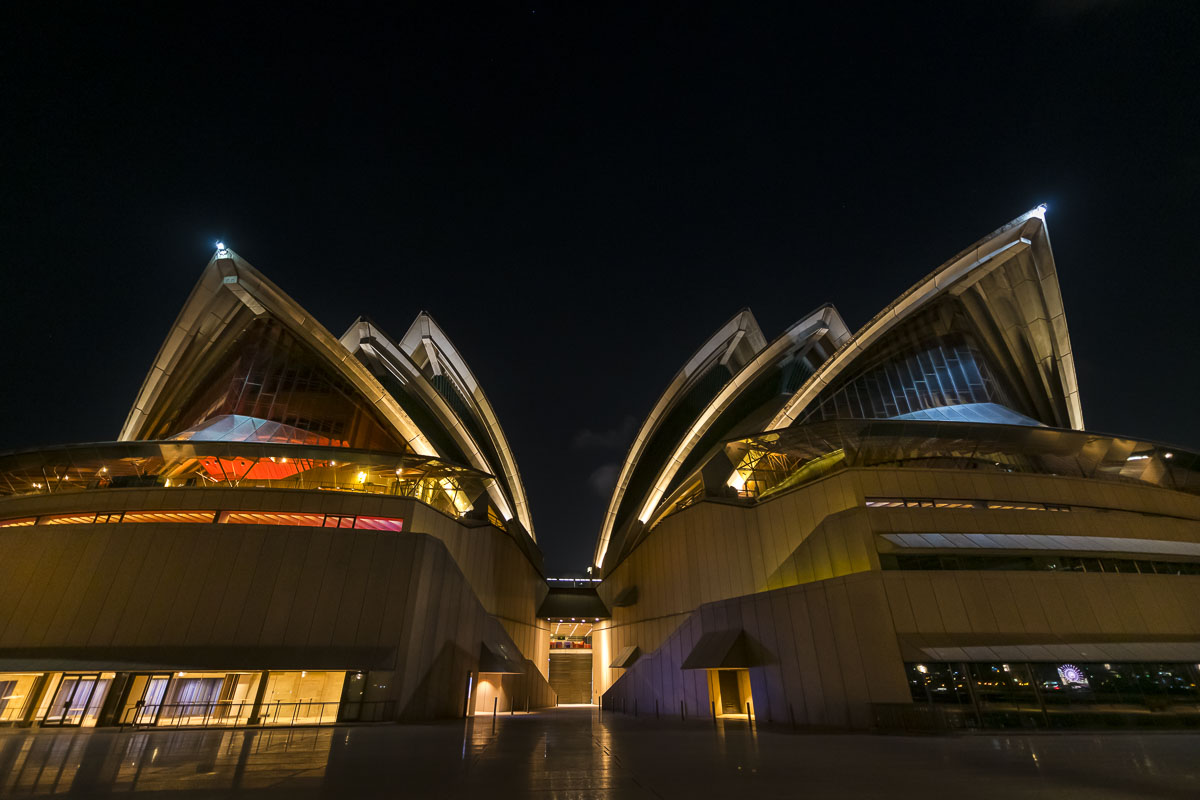 Twin elements of the Sydney Opera House face the downtown waterfront area.