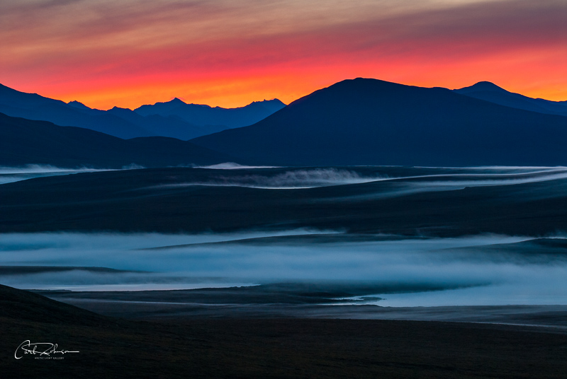 Morning fog rolls in from the Nigu Valley in early autumn, Gates of the Arctic National Park & Preserve.