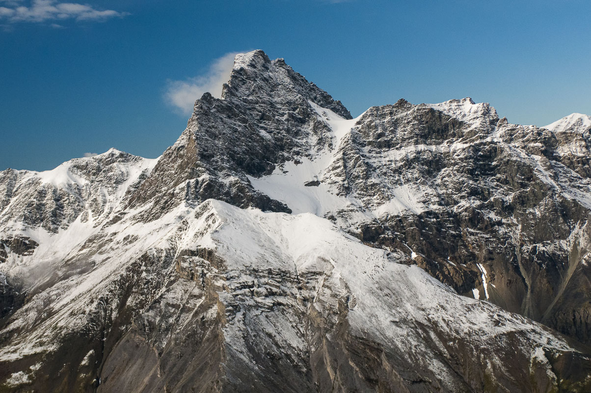 Winds blow loose snow off the face of Mt. Doonerak in the Brooks Range, Gates of the Arctic National Park & Preserve.